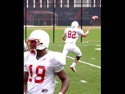 Jeff Dugan, tightend, #82, goes out for the pass while wide reciever Jafar Williams takes direction from a coach.