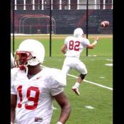 Jeff Dugan, tightend, #82, goes out for the pass while wide reciever Jafar Williams takes direction from a coach.