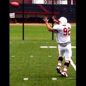 Darren Sanders, tightend, practices an offensive play.