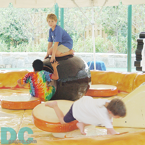 Boys were playing at one of the Kid's Farm attractins. 