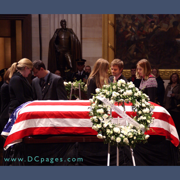 Becca Ford Cook, Sarah Ford Goodfellow, Hannah Ford, Heather Vance and Tyne Vance Berlanga slipped inside the velvet rope and placed their hands on the coffin.