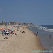 Ocean City - Coastline image from 50th street of vacationers setting up for the day at 11:00am.
