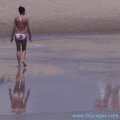 Ocean City - This young woman walks down the Ocean City coastline.