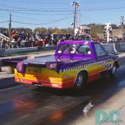 Another look at that winners flag 1991 Chevy S-10 top-fuel Pickup. The parrachute appers to be off center, but is actually hanging from the giant spoiler.