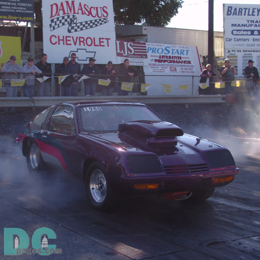 1980 Chevy Monza in the burn-out pit. These cars came with an optional 305ci V8 that was known for twisting the frame of the car. This one has it under control!