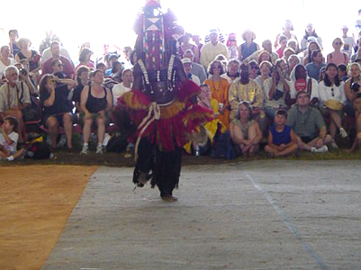 His mask represents the ancestors of the Dogon people and the style a snake.  Entering and exiting the tent was a talent in itself, the ability to move the head back in forth in sync with the music was impressive