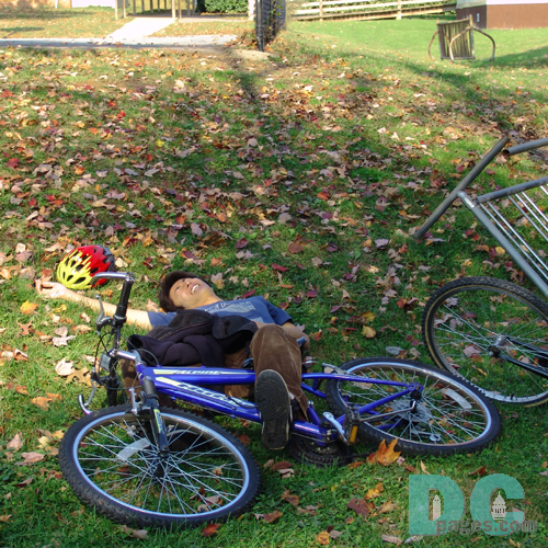 Oh NO! A young man fell off his bike!
