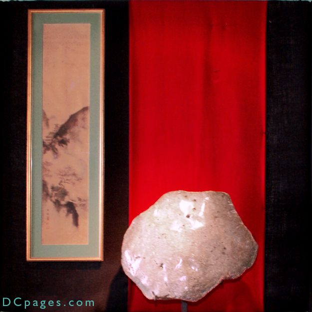 Asymetrical petrified river sediment from central Cambodia. Estimated age is between 10-14 million years old. Top surface is fully polished, having  numerous seashells and three footprints. Reverse side has negative image of a fish! Whole elevated on custom steel stand. 26"W x 21". Most striking!!