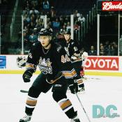 Defenseman Steve Eminger looks to create a turnover in his defensive end.