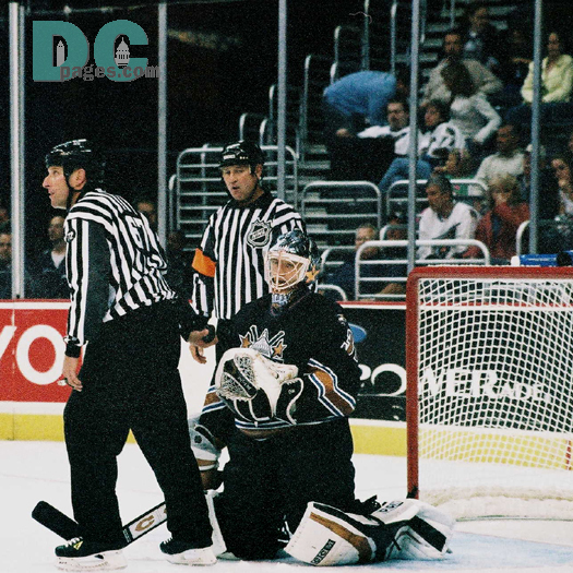 Olie Kolzig gives the puck to the linesman after making a big save.