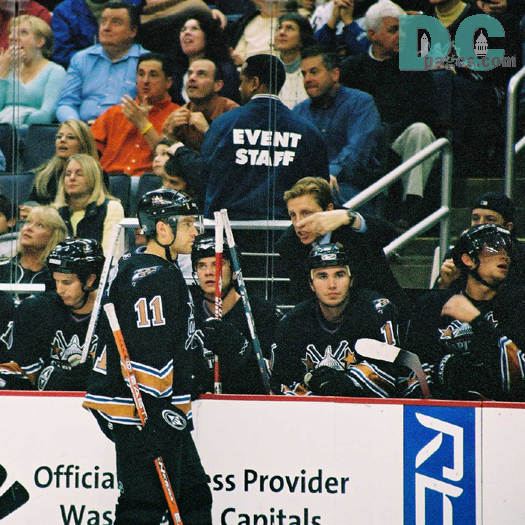 Coach Glen Hanlon talks strategy while a timeout has been taken.