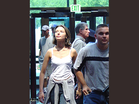 A tourist looks in awe as she enters the great lobby of spectacle.