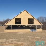 The nearly completed indoor riding arena boasts heated stadium seating!