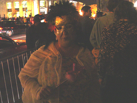 Dressed appropriately for a masquerade ball