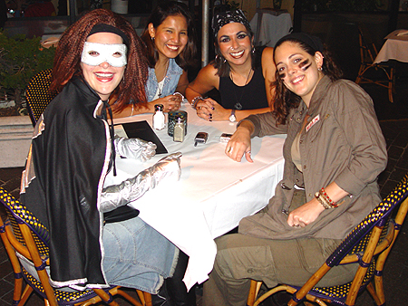 Four very hungry Halloweeners waiting for a quick bite at this street side cafe
