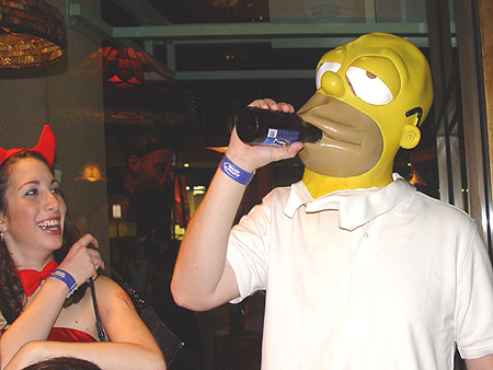 Homer Simpson drinking a brewski with his girl fiend. I thought he was a Duff bear man.