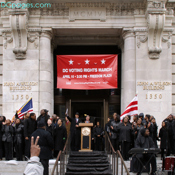 A young and energetic choir performs at city hall before the 04/16/07 protest march to Capitol Hill.