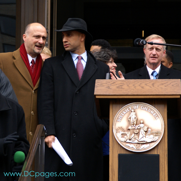 DC Vote Executive Director, Ilir Zherka, shares his thoughts with the Mayor. DC City Council member Jack Evans is on the far right.