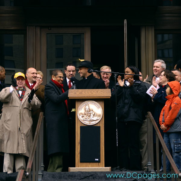 Mayor Adrian M. Fenty hands over the microphone to Congresswoman Eleanor Holmes Norton.
