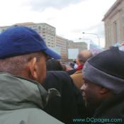Former Mayor Anthony Williams speaks to a District Youth about the historical signicance in participating in the DC Voting Rights March.