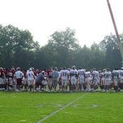 One big team huddle before breaking the offense and defense apart.