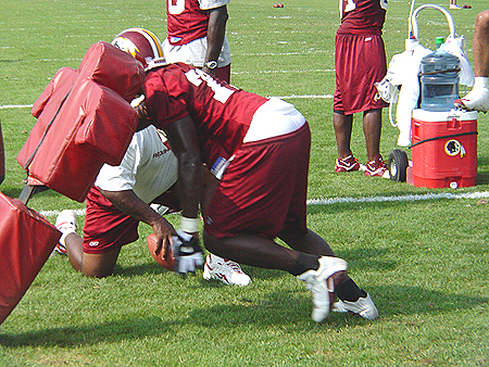 DE Bruce Smith shows how one of the greatest to ever play hits the pads.
