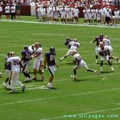 A Raven just stares as Redskins running back finds hole in Baltimore's defense that a truck could drive through. 