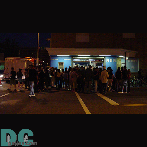 People wait outside after the show ends.