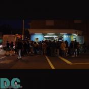 People wait outside after the show ends.