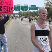 Many people held up signs to encourage the runners.