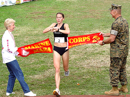 Heather Hanscom crosses the finish line and is the first woman to complete the race.