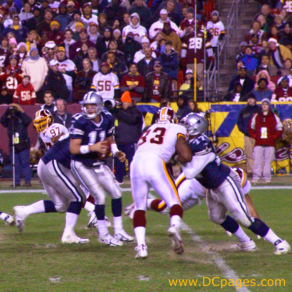 53 Marcus Washington makes a bee-line for Drew Bledsoe.