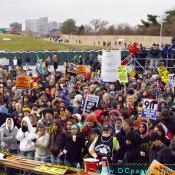 Crowd of protesters gather at the podium.