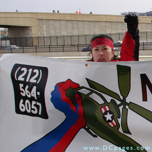 Protester holds up her sign.