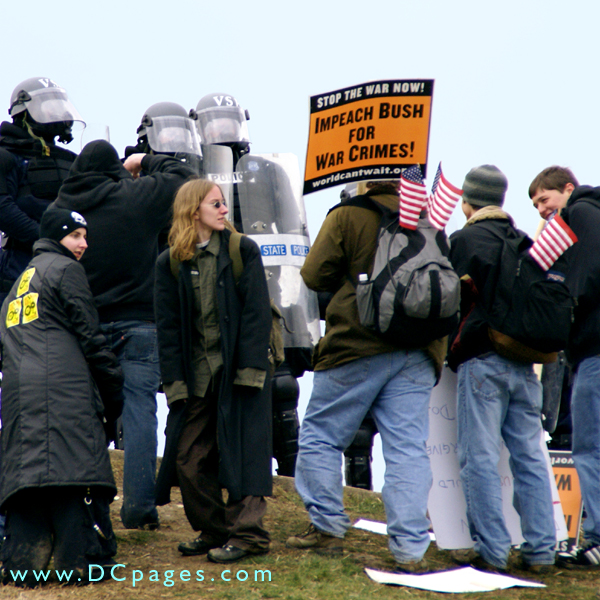 Demonstrators confront police.