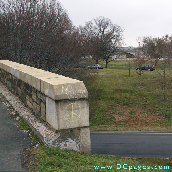 Chalk peace symbol graffiti on a bridge over George Washington Parkway.