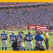 A moment of silence. The National Anthem is played while the National Flag is being displayed.