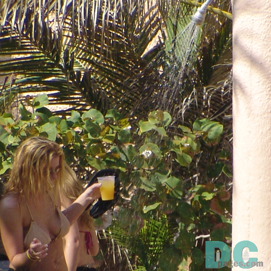 girl taking outdoor shower