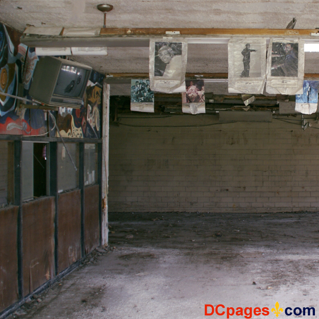 August 2, 2007 - Ninth Ward of New Orleans - 5300 Law Sreet, New Orleans, 70117, LA 504-942-3602 - Alfred Lawless High School - Photos and a broken television set hang from the ceiling.  