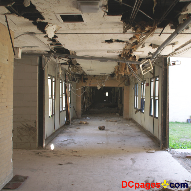 August 2, 2007 - Ninth Ward of New Orleans - 5300 Law Sreet, New Orleans, 70117, LA 504-942-3602 - Alfred Lawless High School - Hallway - Insulation is falling from the ceiling - Part of the outside wall is missing.