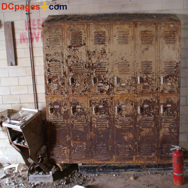 August 2, 2007 - Ninth Ward of New Orleans - 5300 Law Sreet, New Orleans, 70117, LA 504-942-3602 - Alfred Lawless High School - Mangled water fountain, rusty lockers, and a fire extinguisher.