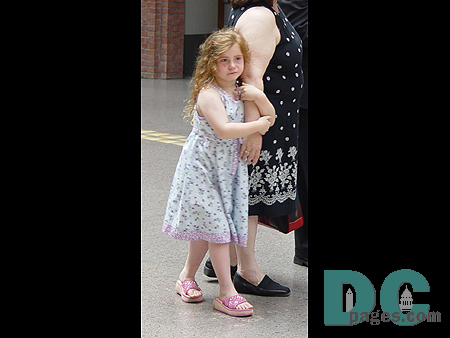A very emotional little girl who has come to see the exhibitions with her mother.