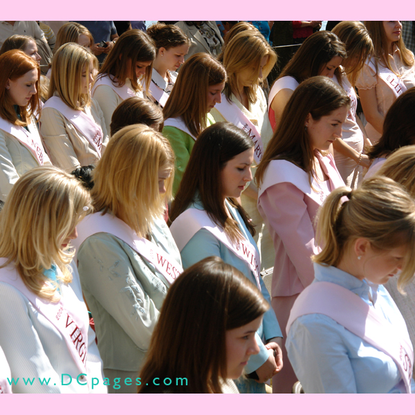 National Cherry Blossom Princesses bow their heads during the openning prayer.