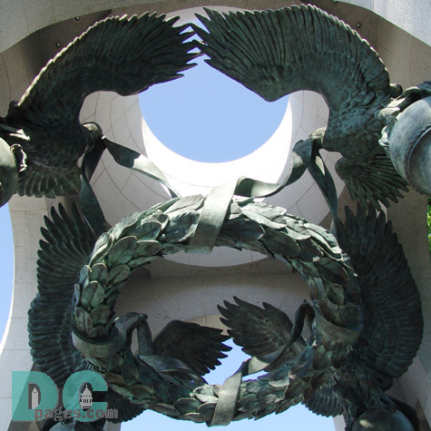 Four bronze American eagles circle over a suspended victory laurel to memorialize the victory of the WWII generation. 