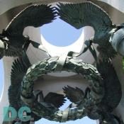 Four bronze American eagles circle over a suspended victory laurel to memorialize the victory of the WWII generation. 