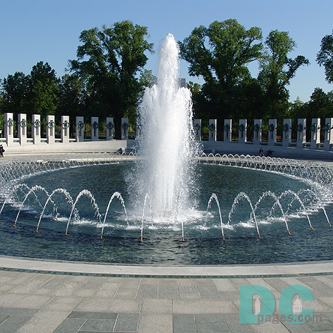 Southeast to Northwest view of the Rainbow Pool: 246'-9" long; 147'-8" wide.  Bronze wreaths with armatures (2 wreaths on each pillar, one on each side) are in the background.