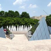 The older West Building (opened 1941) is based on foursquare, right-angled forms, while the newer structure interlocks complex, shifting triangular shapes.  These shapes are located between the walkway that divide the East and the West Buildings of the Gallery.