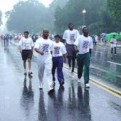 Determined supporters walk through the rain