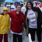 Even soaking wet, a mother and her two sons pose with smiles after finishing the race.