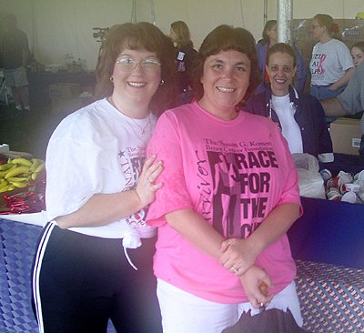 Supported by her friend, this survivor celebrates her day